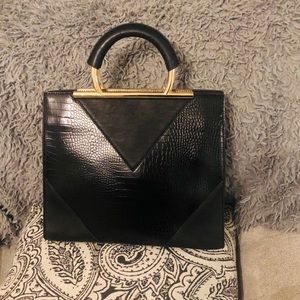 Faux leather handbag. Crocodile embossed detail.